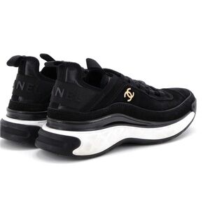 CHANEL Black and White Athletic Shoes with Gold Emblem